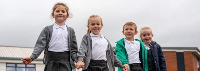 CEC Children holding hands and playing the playground